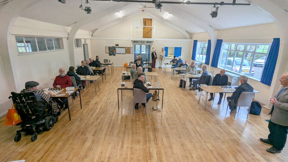 A hall full of team players ready to play chess for the Schofield trophy