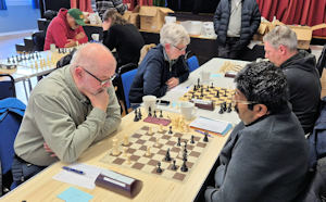 2 games of chess being played